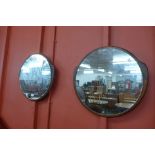A pair of Clark Eaton circular teak framed mirrors