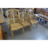 A set of six Victorian style elm Windsor chairs