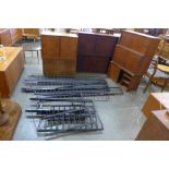 Assorted Danish teak room divider cabinets and black metal ladders