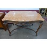 A French Louis XV style carved walnut and marble topped serpentine centre table