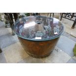 A Victorian copper coal bin (converted to a coffee table)