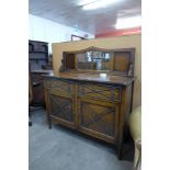 An early 20th Century oak mirrorback sideboard