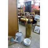 A brass stick stand, a galvanised watering can, etc.