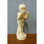 A faux marble figure of a cherub