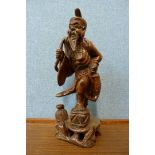 A Chinese carved hardwood figure of a Sage