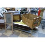 A pine apple crate, a walnut valve radio, a Formica topped coffee table and a washboard
