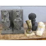 A pair of lion bookends, two busts and a carved onyx Sphinx