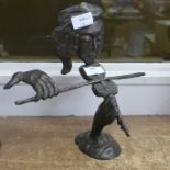 A bronze abstract violinist statue