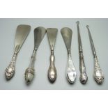Six silver handled tools, two button hooks and four shoe horns