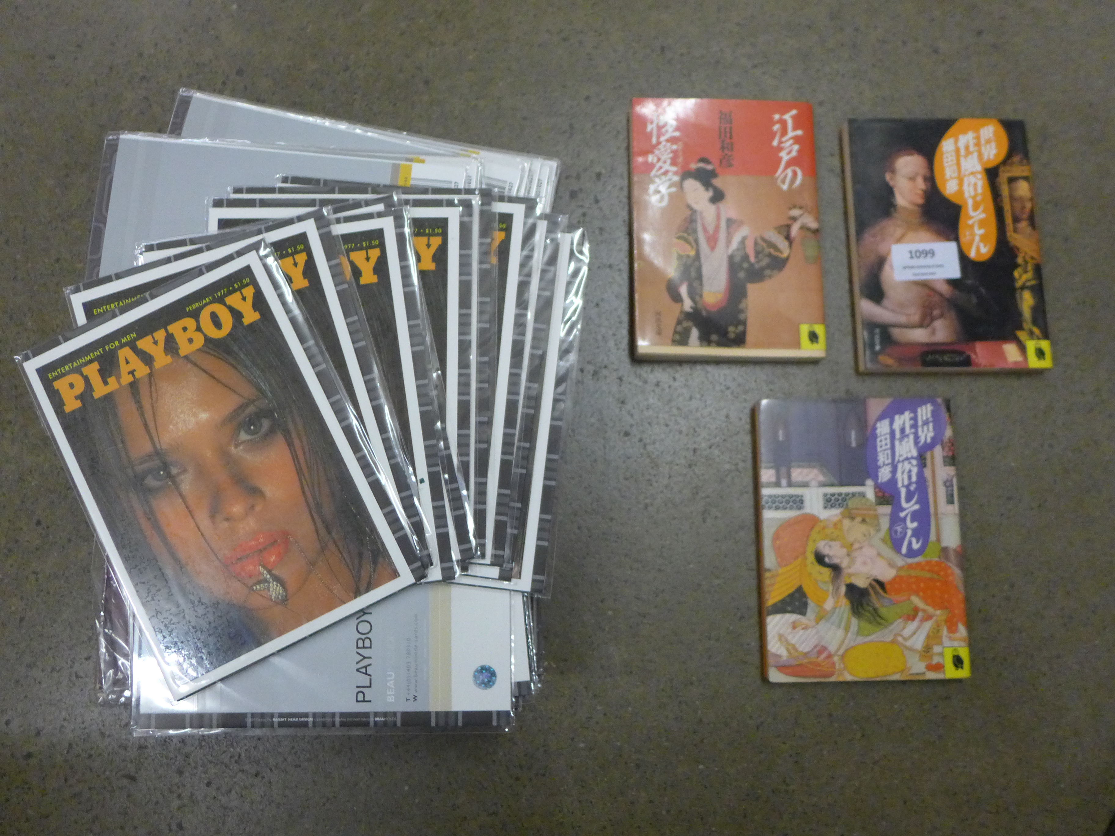 Two Playboy magazines, Playboy birthday cards and Japanese and Thai adult books