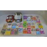 30 Reverse holo & 300 rare/uncommon and common Pokemon cards in tin