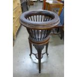 A Victorian carved mahogany jardiniere on stand