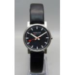 A Mondaine black dial wristwatch