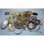 A collection of costume jewellery and a mother of pearl purse