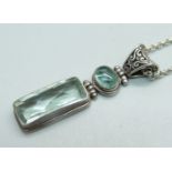 A silver, green and blue stone pendant and chain