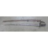 A US sword and scabbard, the etched blade marked Clauberg, Solingen, iron proof