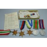 A collection of WWII medals including The Atlantic and Italy Star