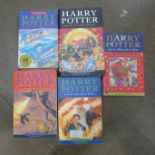 Five Harry Potter novels, two first editions