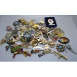 A collection of vintage costume brooches