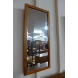 A teak framed mirror