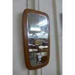 A teak framed mirror