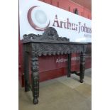 A Victorian Jacobean Revival carved oak hall table