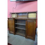 A Victorian Aesthetic Movement walnut breakfront bookcase