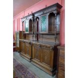 A pair of 19th Century French Henry II style carved oak side cabinets