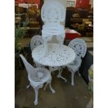 A Victorian style cast alloy garden table and four chairs