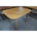 A Nathan teak extending dining table