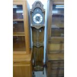 A French carved oak longcase clock