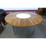 A Merrow Associates rosewood and chrome circular dining table, with white laminate lazy Susan to