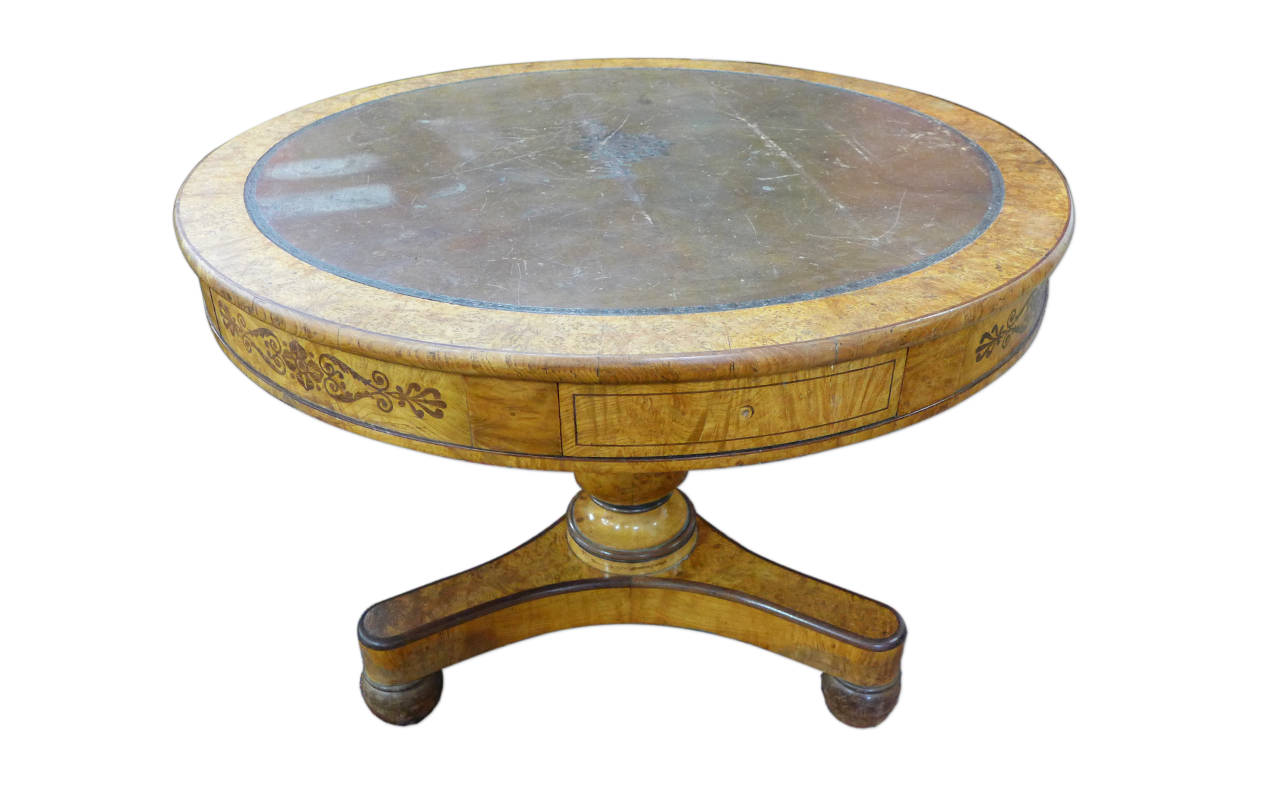 A Regency birds eye maple and leather topped drum shaped library table, manner of George Bullock