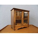 An early 20th Century oak smokers cabinet