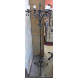 A French wrought iron floor standing candle stand
