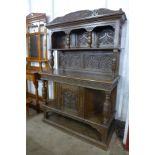 An Elizabethan Revival carved oak dresser