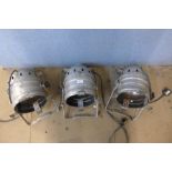 A set of three chrome theatre spotlights