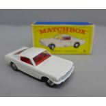 A Matchbox no.8 Ford Mustang with white body and red interior, boxed