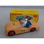 A Dinky Toys 111 TR2 Sports Car in peach with blue interior, boxed