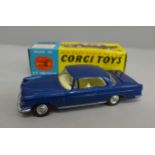 A Corgi no.253 Mercedes 220SE Coupe with blue body and lemon interior, luggage in boot, spare