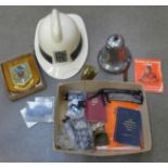 Fire service memorabilia; a Rolls-Royce branded fireman's helmet and a fire bell stamped Winkworth