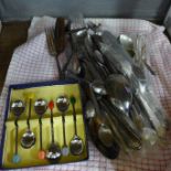 A collection of plated flatware and other flatware