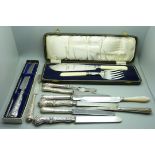 A fish knife set with silver ferrules, a silver handled cake knife, silver handled cutlery and three