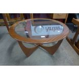 A G-Plan Astro teak and glass topped circular coffee table