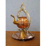 An Arts and Crafts copper and brass kettle on stand, manner of W.A.S. Benson