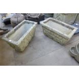 A pair of rectangular concrete garden planters