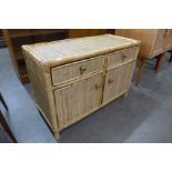 A small Italian bamboo and rattan cabinet
