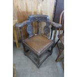 A Victorian Jacobean Revival carved oak corner chair