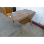 An Ercol Blonde elm and beech Windsor drop leaf table