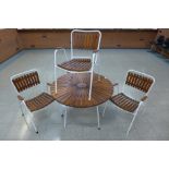A Danish Daneline teak and white tubular metal garden table and four chairs